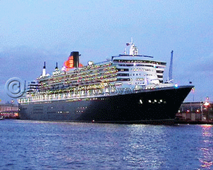 Dusk view of QM2, Stbd Bow